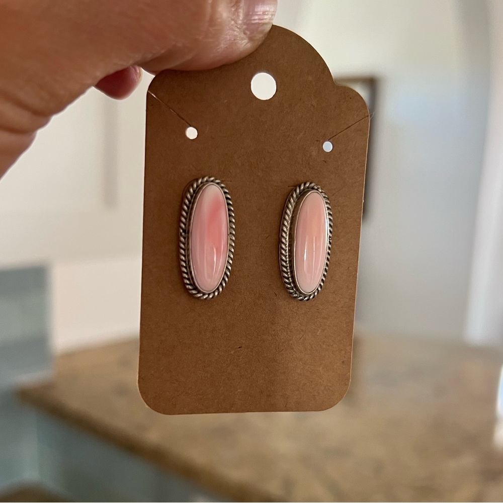 Signed and stamped Jay Begay pink conch navajo stud earrings